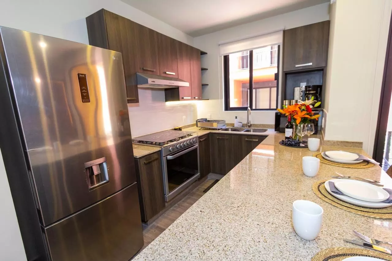 Departamento Nahme Quintas de Allende — Quinta de Allende, San Miguel de Allende — photo 5 — contemporary chef's kitchen, gleaming stainless