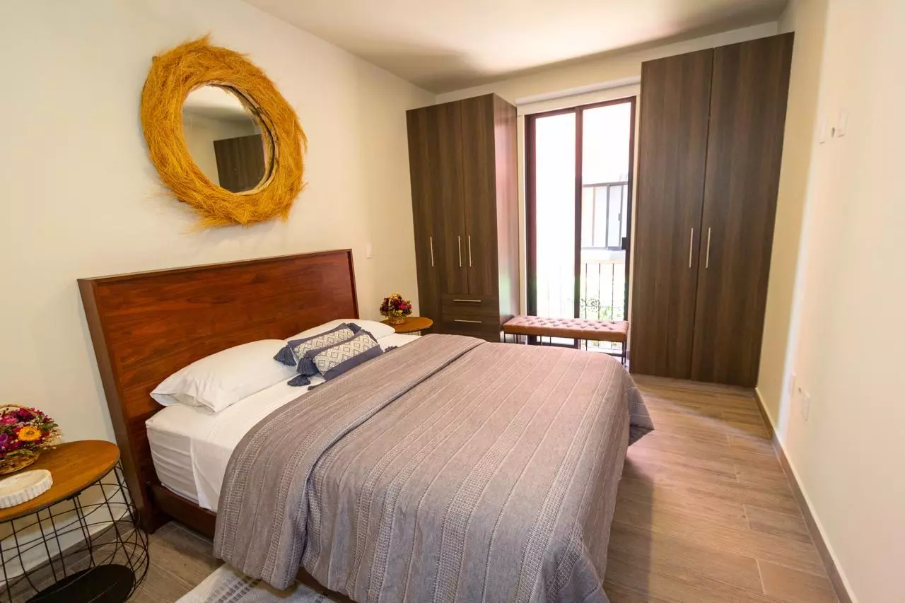 Departamento Nahme Quintas de Allende — Quinta de Allende, San Miguel de Allende — photo 2 — serene bedroom with refined wood accents