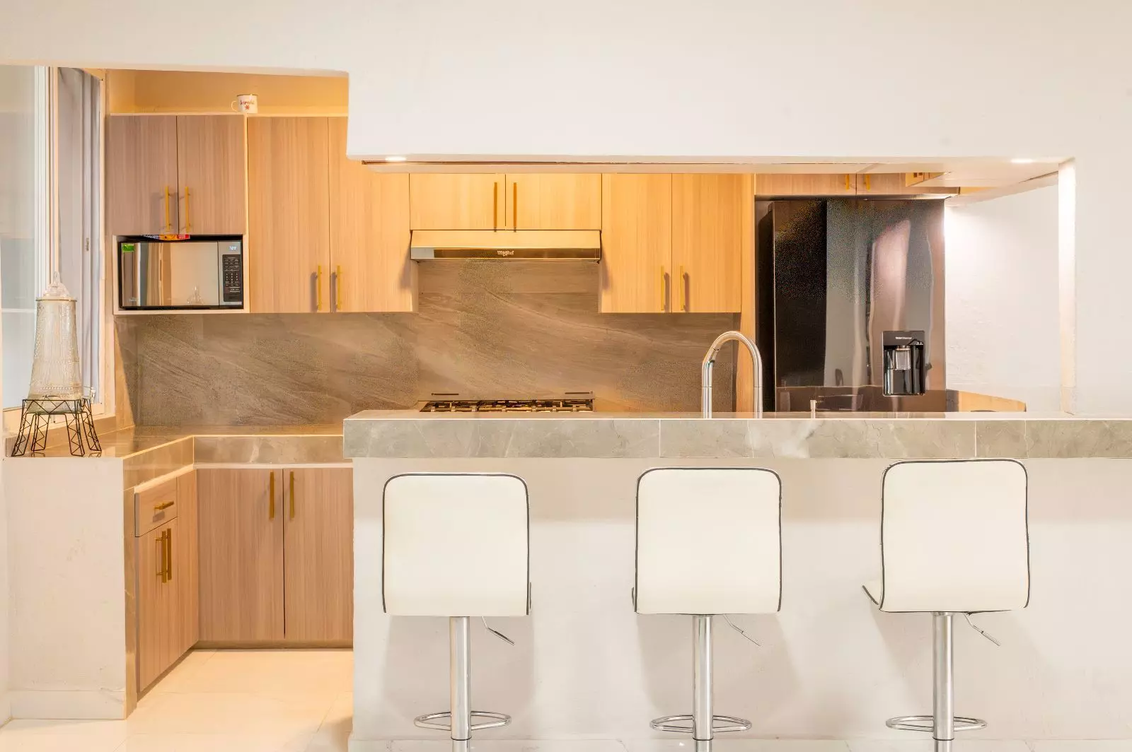 Casa Sara — Lindavista, San Miguel de Allende — photo 7 — sophisticated warm-toned chef's kitchen