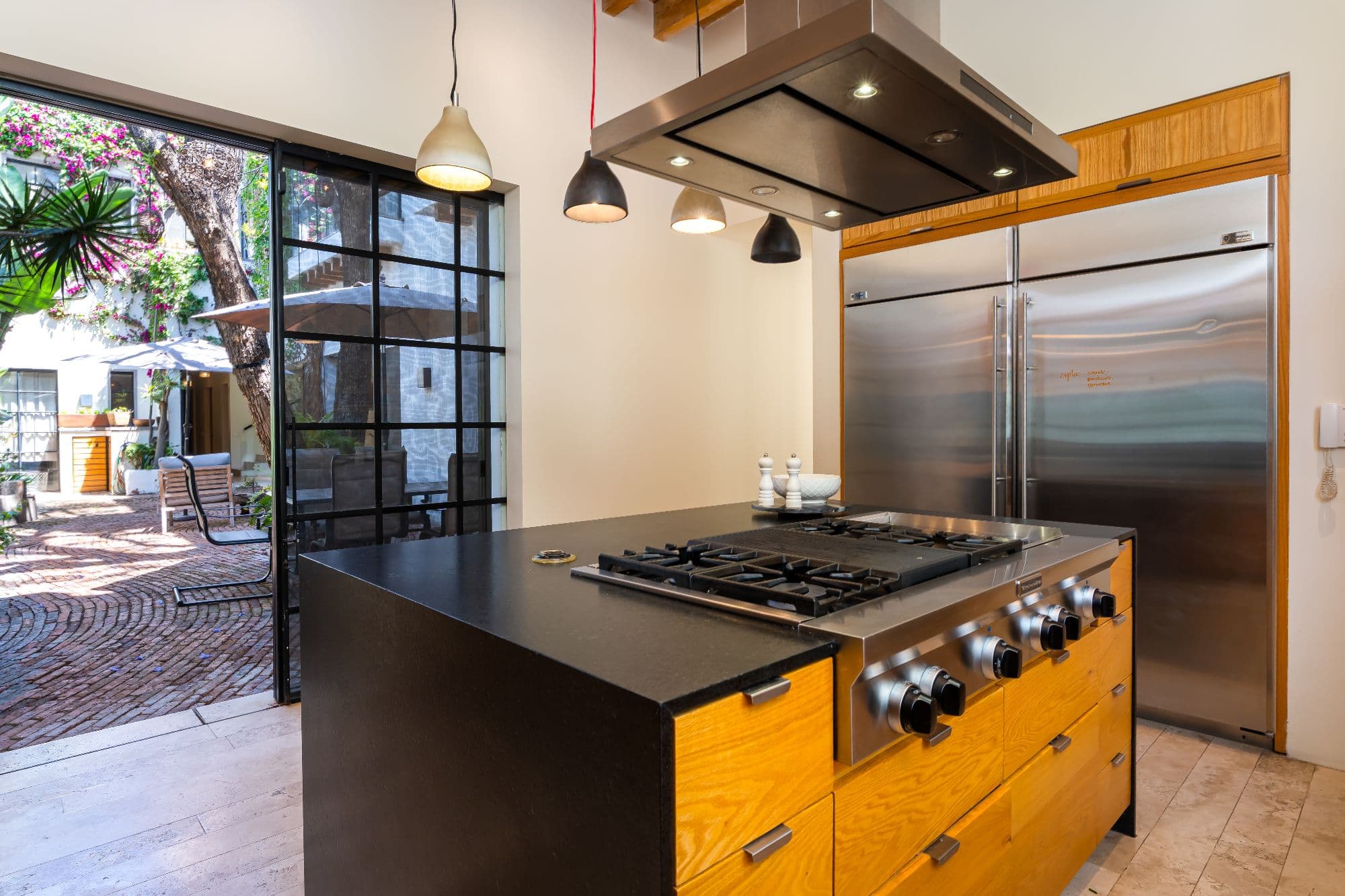 Casa Organza — Centro, San Miguel de Allende — photo 11 — modern chef's kitchen with courtyard views