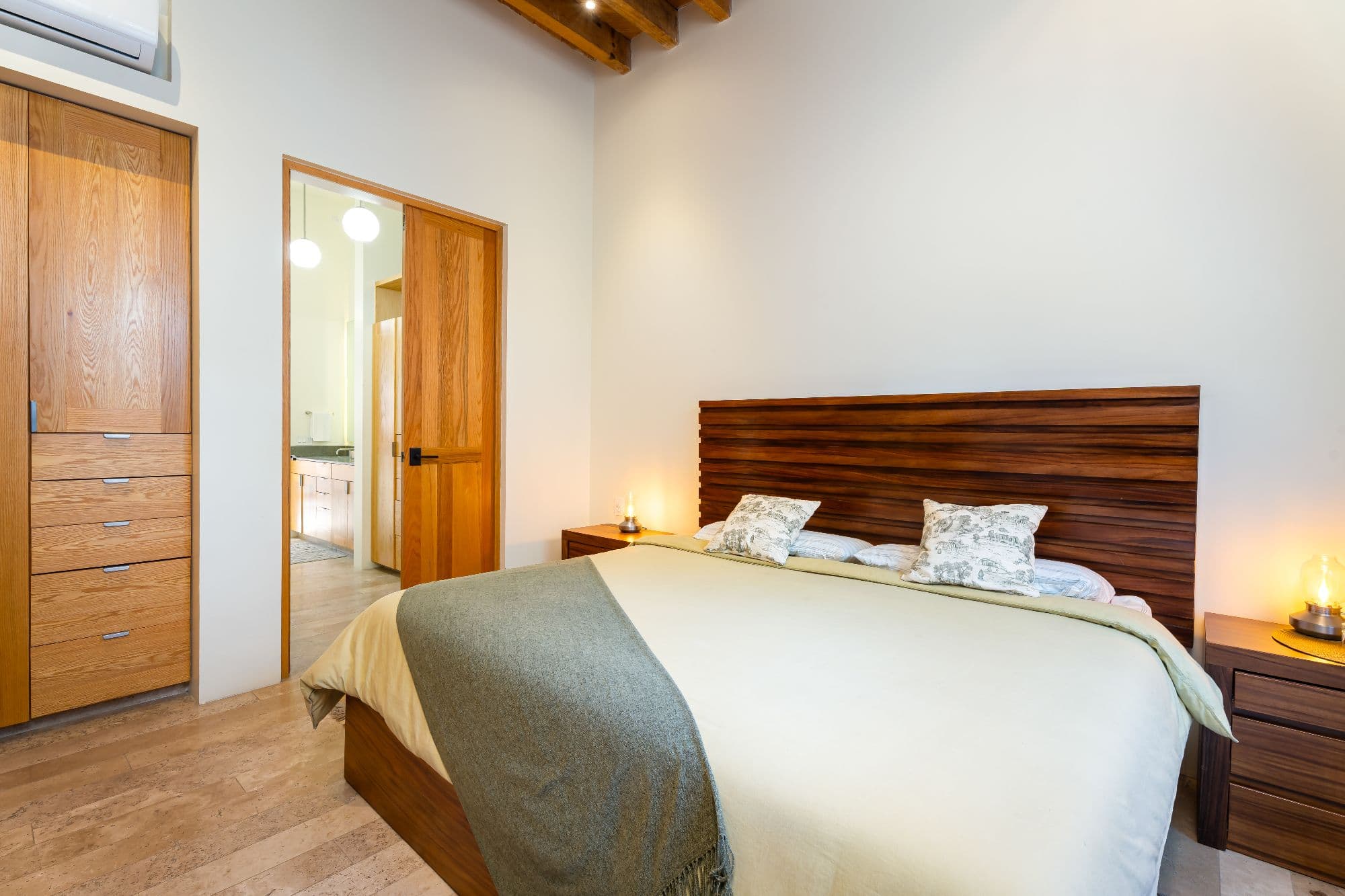 Casa Organza — Centro, San Miguel de Allende — photo 20 — serene master suite, warm wood elegance