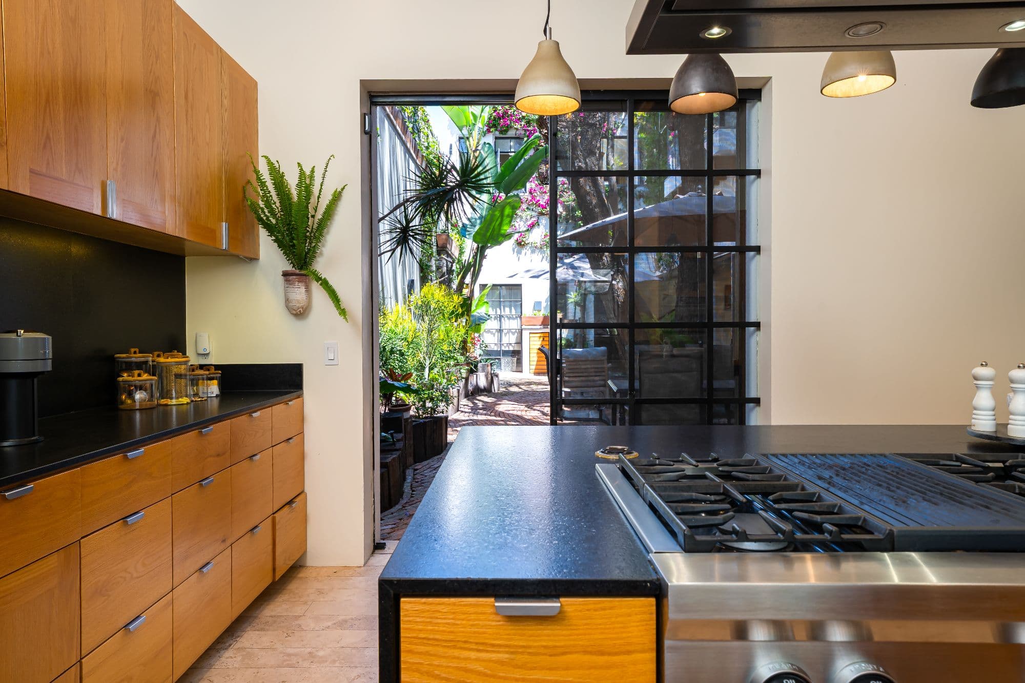 Casa Organza — Centro, San Miguel de Allende — photo 12 — contemporary chef's kitchen, vibrant courtyard views