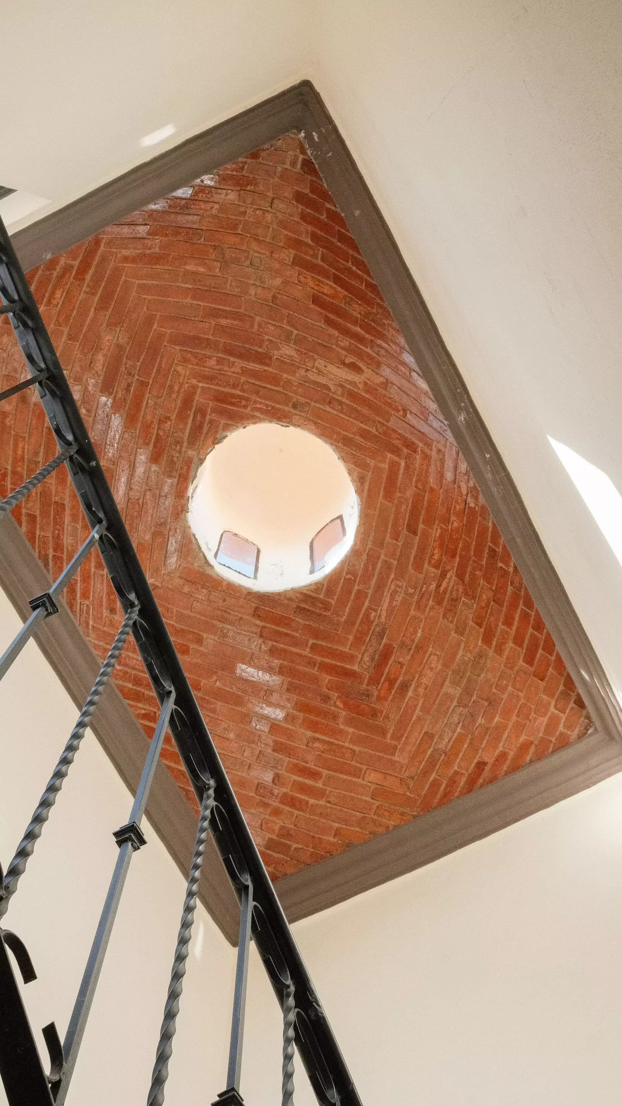 Casa La Lomita — La Lomita, San Miguel de Allende — photo 12 — soaring brick atrium with skylight
