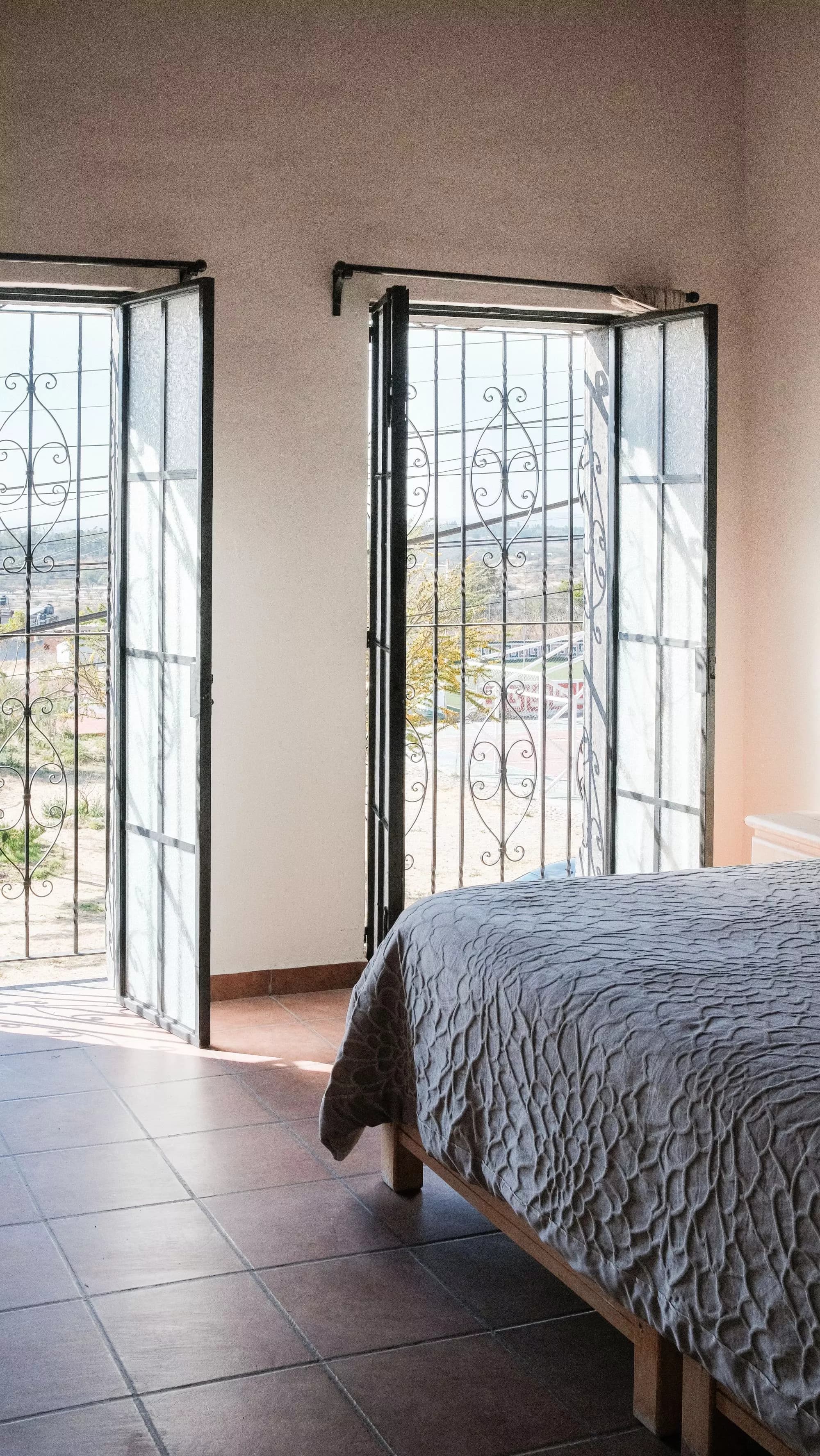 Casa La Lomita — La Lomita, San Miguel de Allende — photo 10 — sunlit bedroom with panoramic vistas