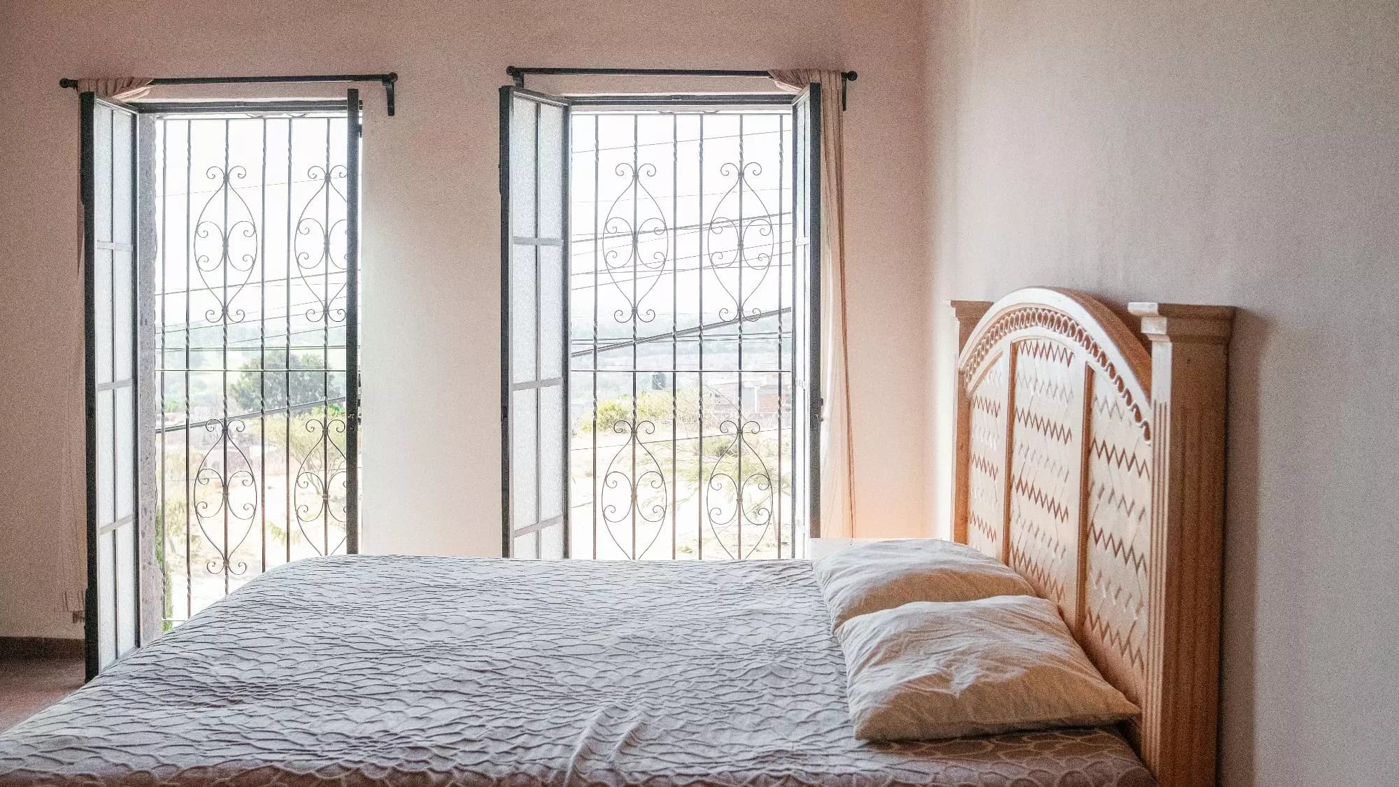 Casa La Lomita — La Lomita, San Miguel de Allende — photo 3 — serene bedroom, colonial elegance, panoramic views