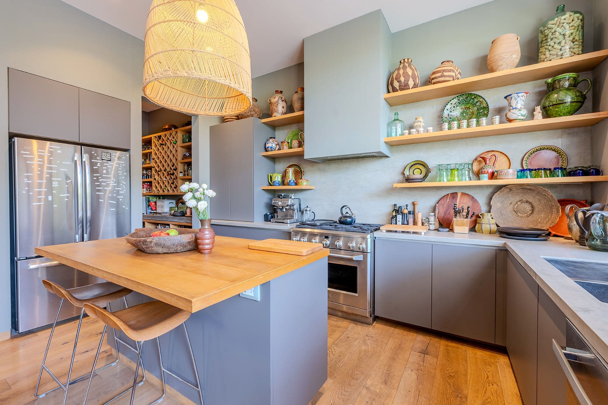 Casa Pirules — Centro, San Miguel de Allende — photo 3 — sophisticated open kitchen, artfully curated shelving