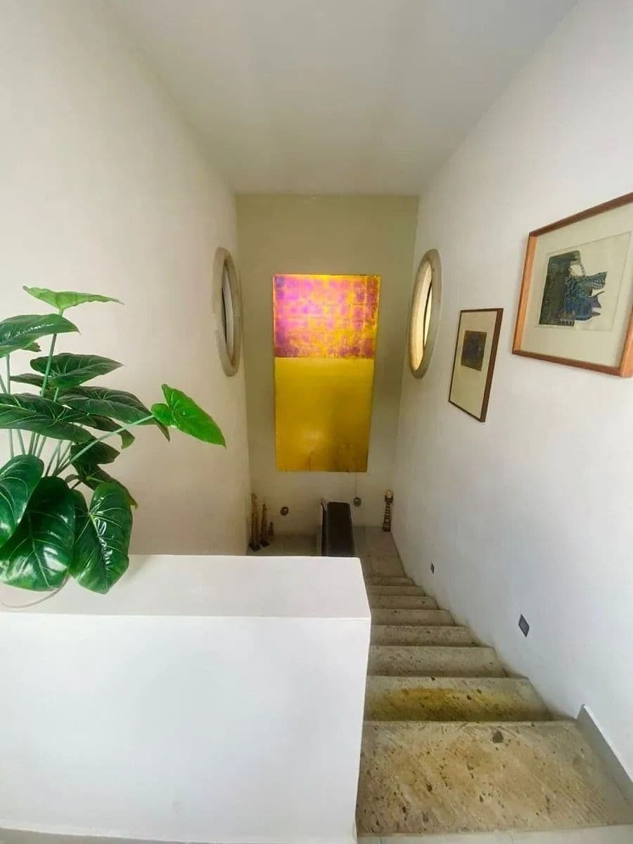 Casa Magenta — El Paraiso, San Miguel de Allende — photo 23 — sunlit gallery passage, artistic charm