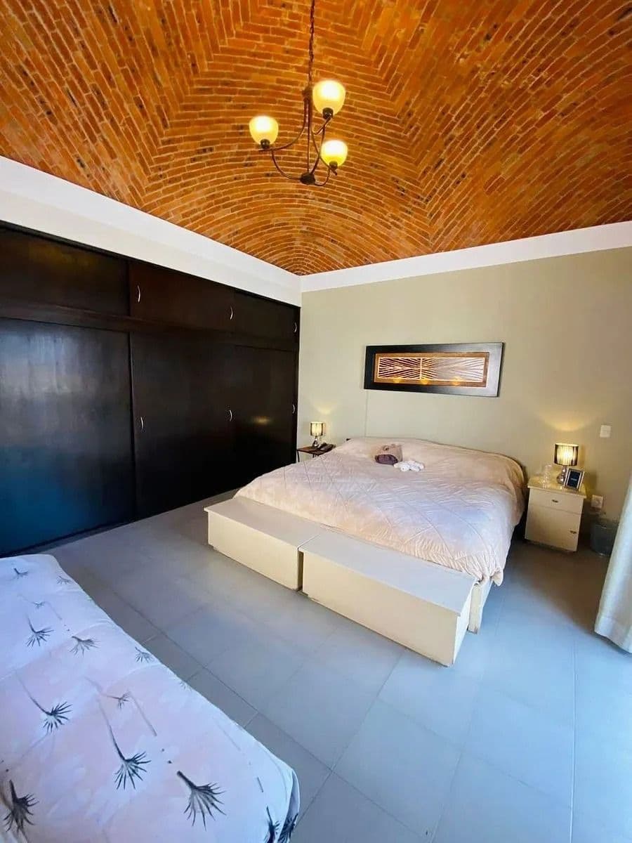 Casa Magenta — El Paraiso, San Miguel de Allende — photo 6 — stunning brick vaulted ceiling bedroom