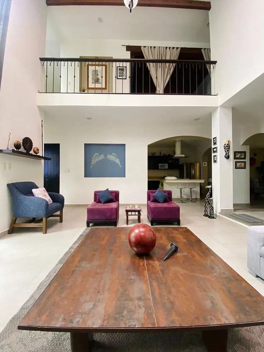 Casa Magenta — El Paraiso, San Miguel de Allende — photo 8 — soaring mezzanine, sophisticated entertainment space