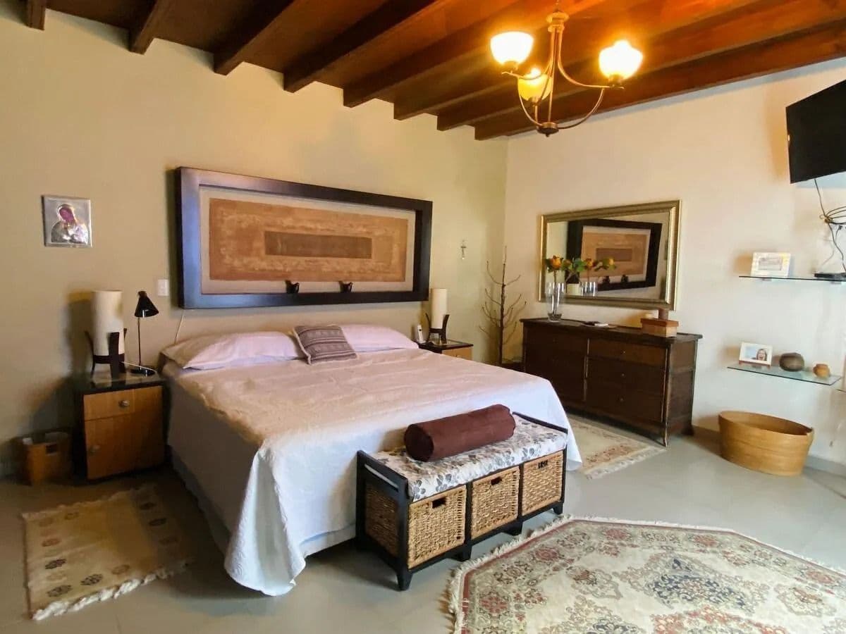 Casa Magenta — El Paraiso, San Miguel de Allende — photo 7 — rustic-chic master suite, architectural beams