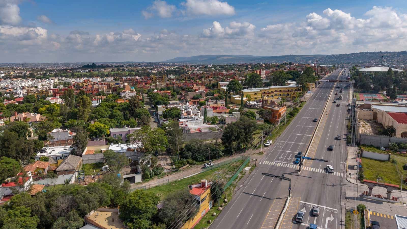Corner Lot Opportunity — Poblado de Don Diego, San Miguel de Allende — photo 10 — panoramic valley views, vibrant urban landscape