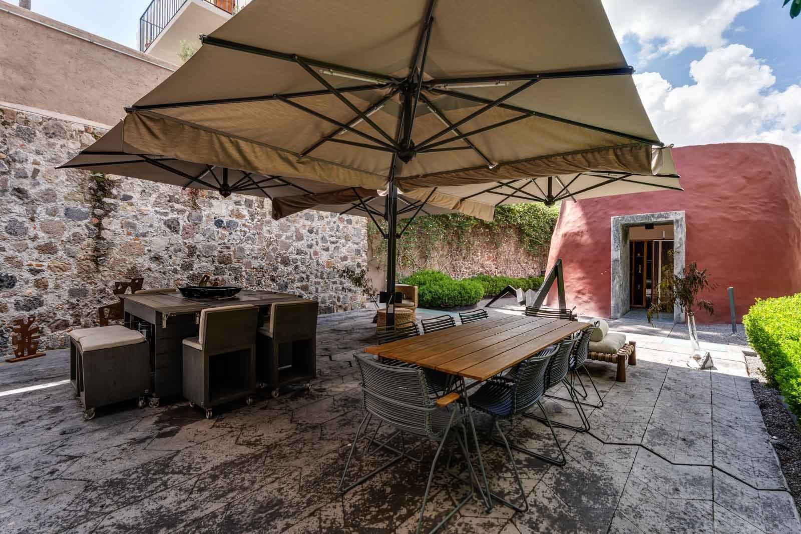Casa Umbral — Centro, San Miguel de Allende — photo 15 — enchanting courtyard with shade umbrellas