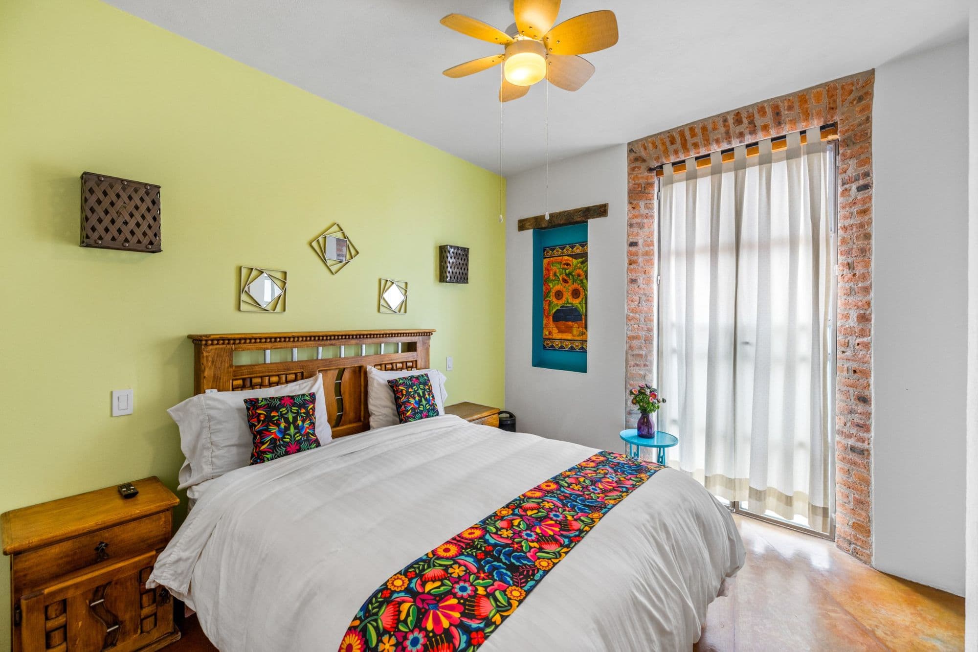 Casa la Luz — San Antonio, San Miguel de Allende — photo 19 — vibrant, light-filled bedroom with character