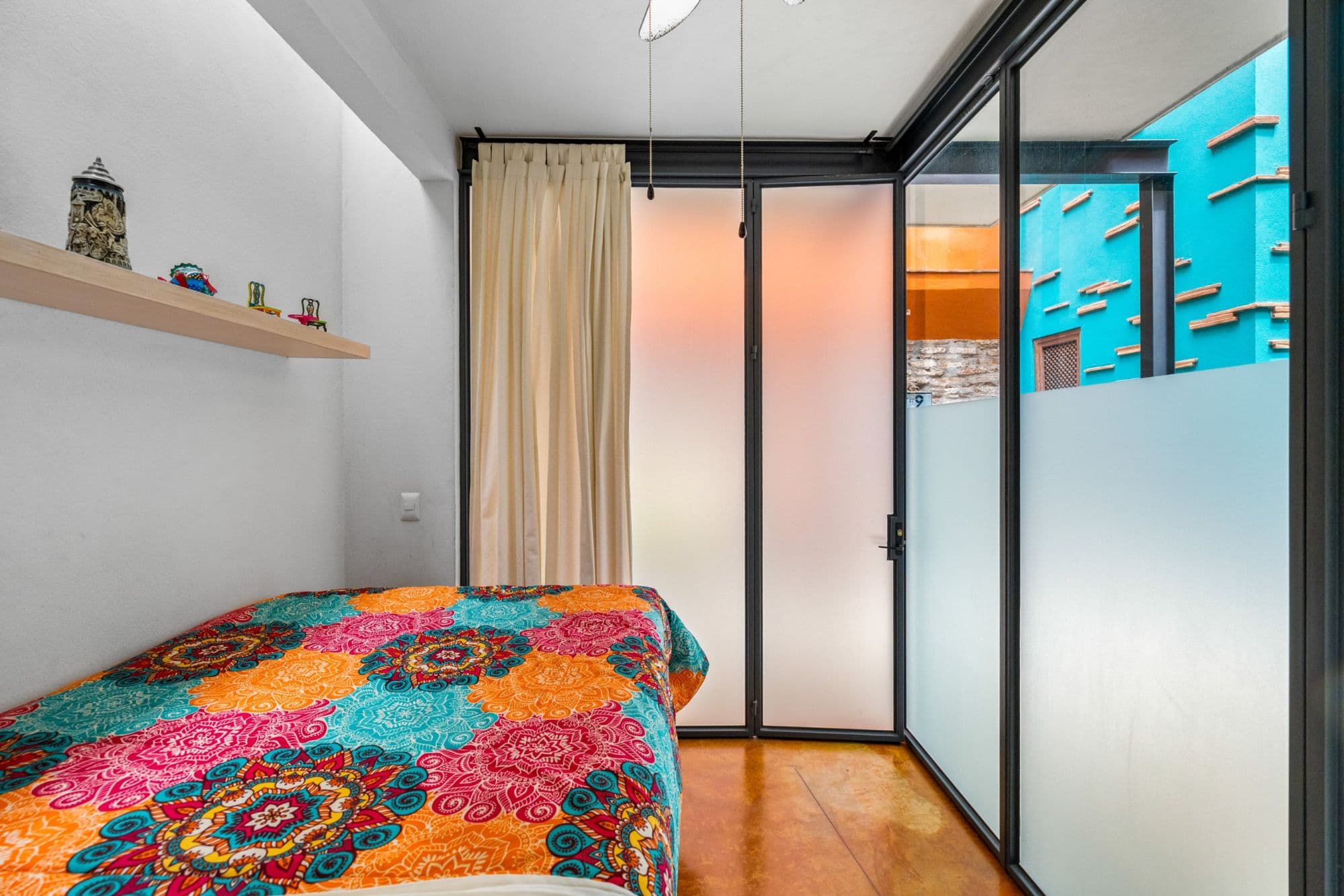Casa la Luz — San Antonio, San Miguel de Allende — photo 31 — vibrant bedroom with terrace views