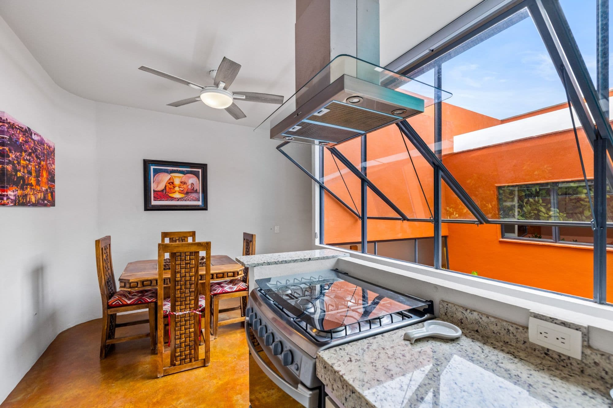 Casa la Luz — San Antonio, San Miguel de Allende — photo 6 — sunlit modern kitchen, vibrant outdoor views