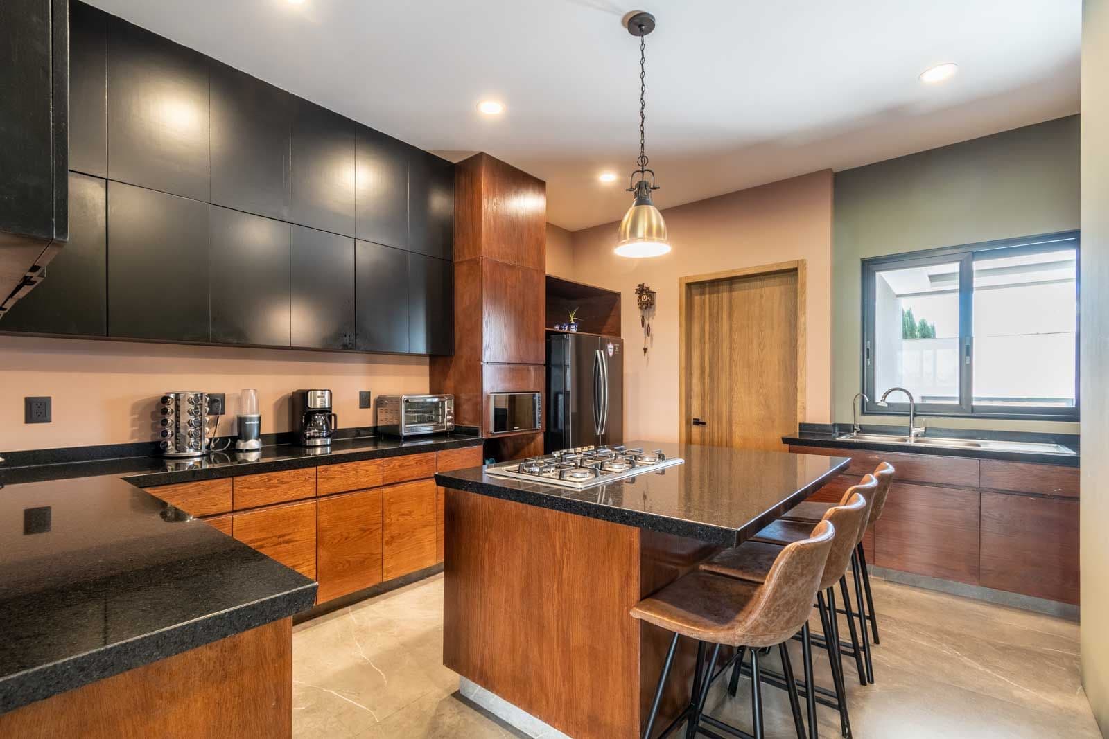 Casa Refugio — Villa de los Frailes, San Miguel de Allende — photo 11 — sophisticated chef's kitchen, gleaming elegance