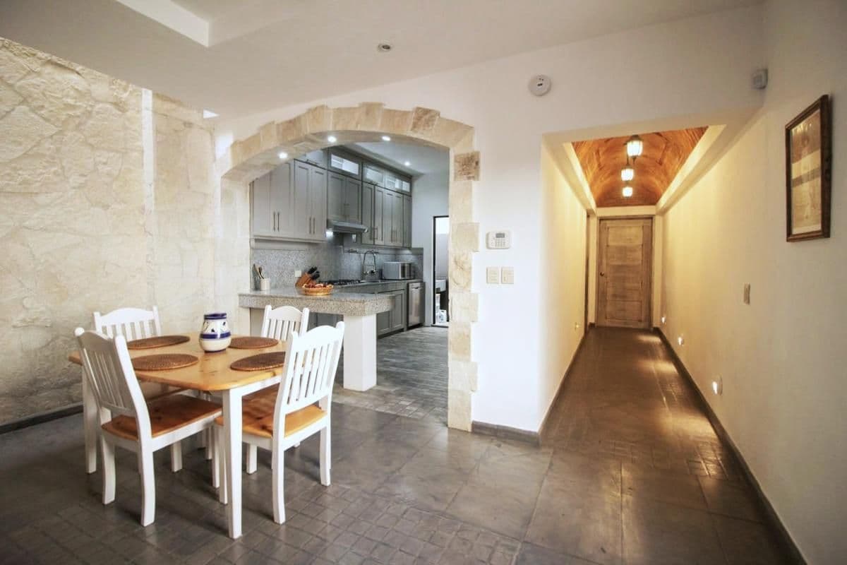 1959 Orizaba 112 — San Antonio, San Miguel de Allende — photo 10 — elegant arched kitchen with warm lighting