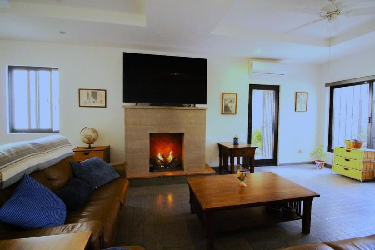 1959 Orizaba 112 — San Antonio, San Miguel de Allende — photo 9 — elegant open living with fireplace warmth