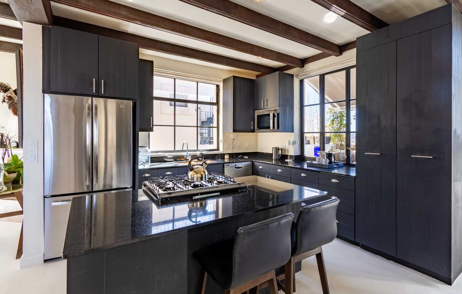 Casa Sol — Centro, San Miguel de Allende — photo 14 — contemporary chef's kitchen with radiant natural light