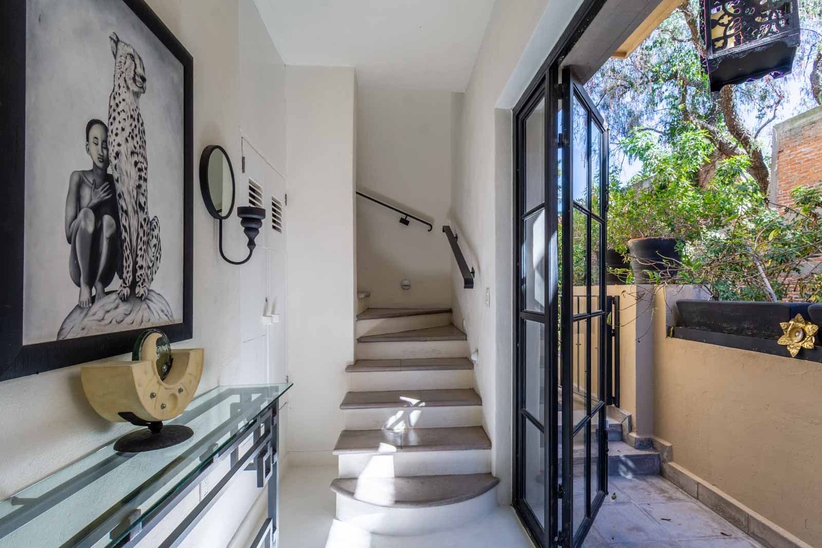 Casa Sol — Centro, San Miguel de Allende — photo 10 — sunlit gallery hallway, curated elegance