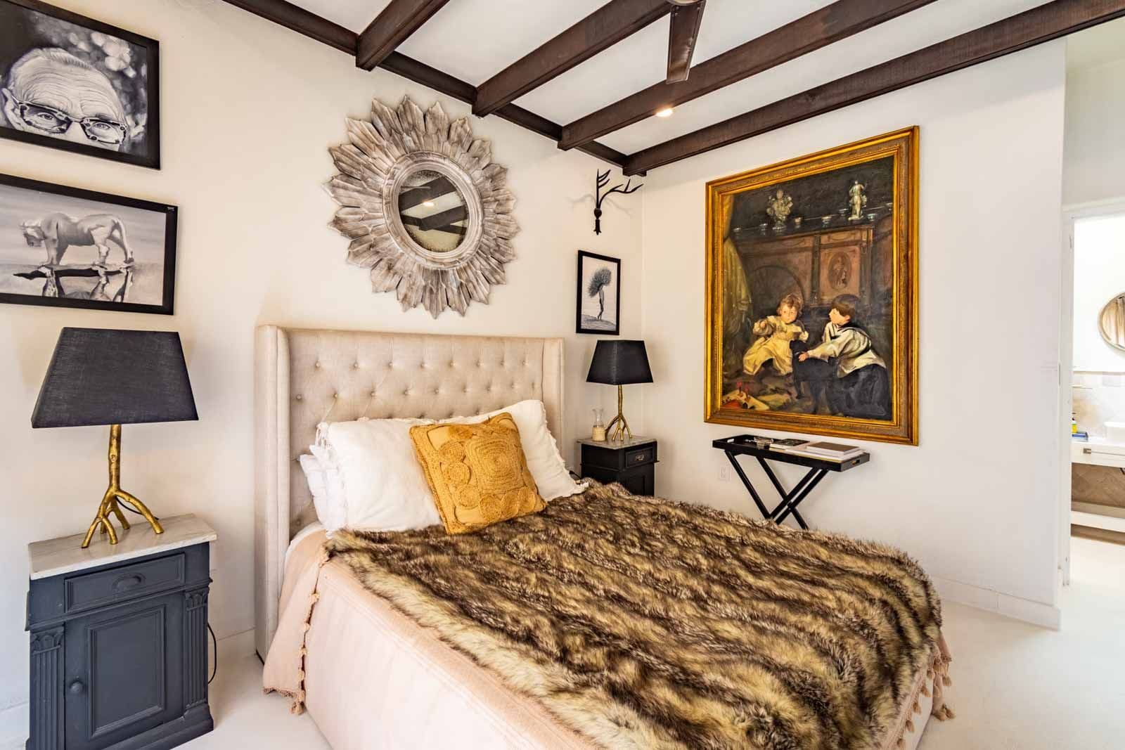 Casa Sol — Centro, San Miguel de Allende — photo 6 — sophisticated bedroom, exposed beams, curated art