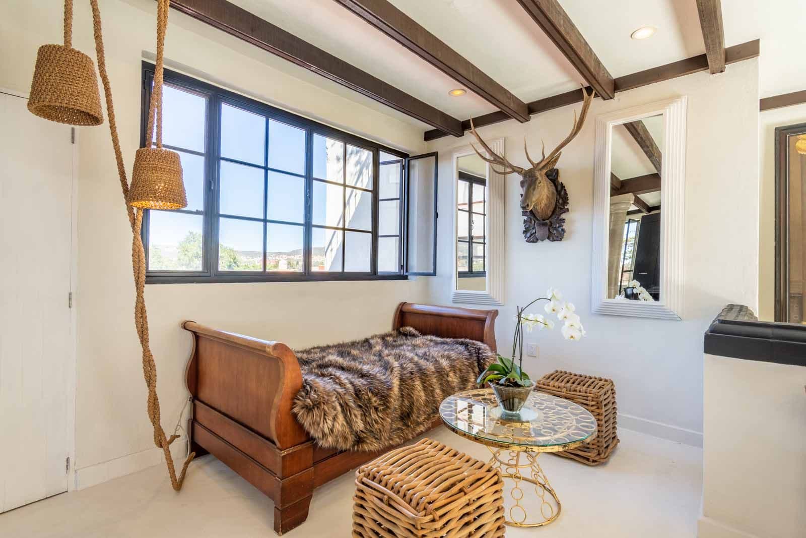 Casa Sol — Centro, San Miguel de Allende — photo 11 — sunlit bedroom with rustic elegance