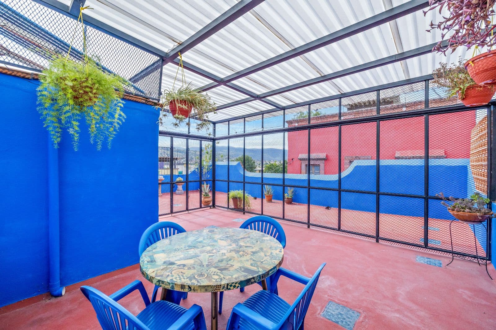 Casa Adelaida — San Antonio, San Miguel de Allende — photo 11 — vibrant entertaining terrace, panoramic mountain views