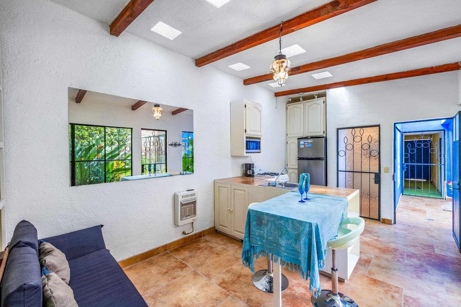 Casa Adelaida — San Antonio, San Miguel de Allende — photo 16 — rustic beams, bright open kitchen