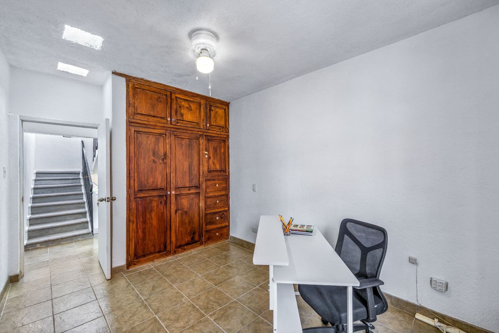 Casa Adelaida — San Antonio, San Miguel de Allende — photo 9 — versatile workspace with authentic wood cabinetry