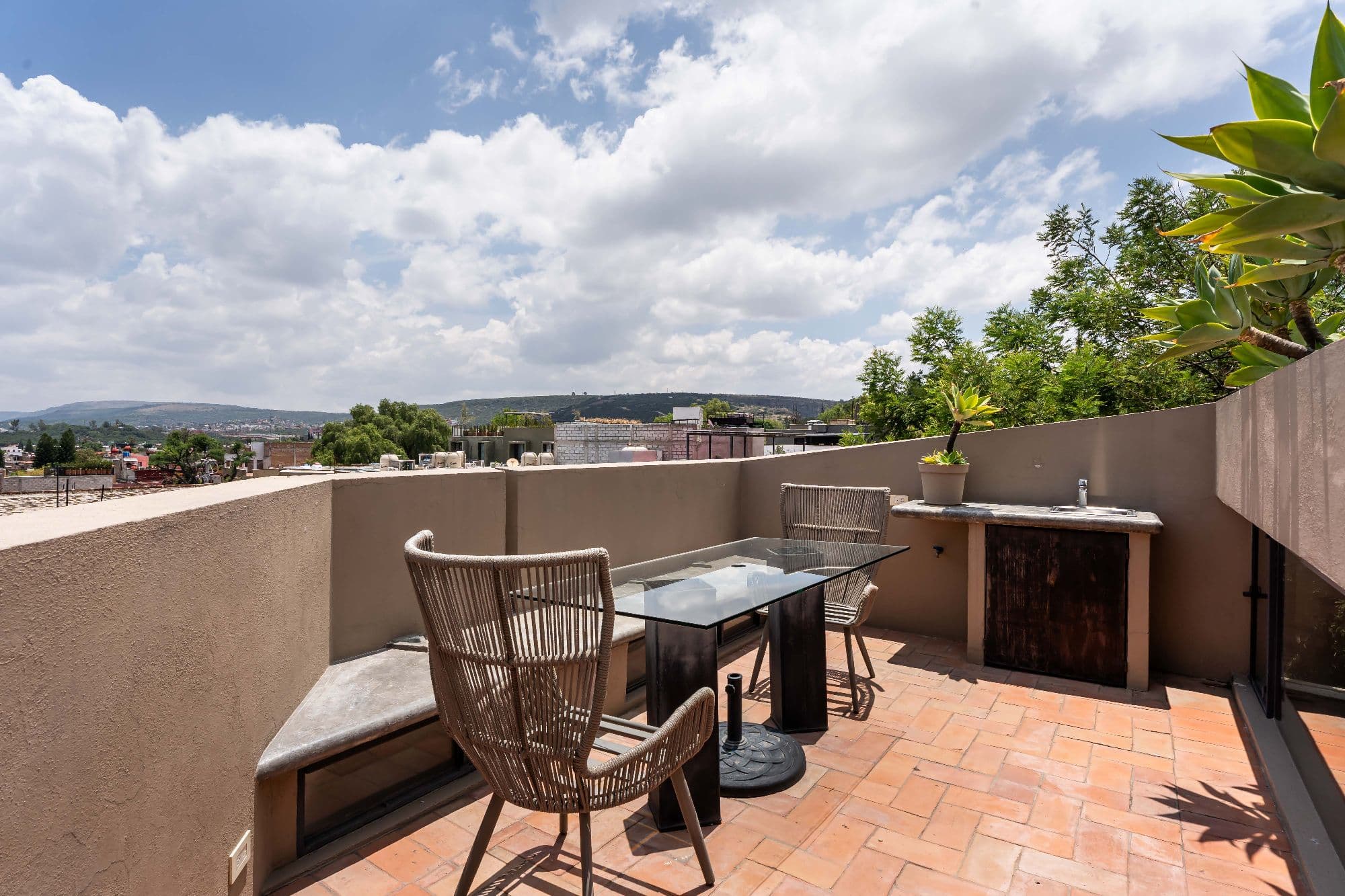 The Lofts — Centro, San Miguel de Allende — photo 20 — panoramic rooftop terrace with mountain vistas
