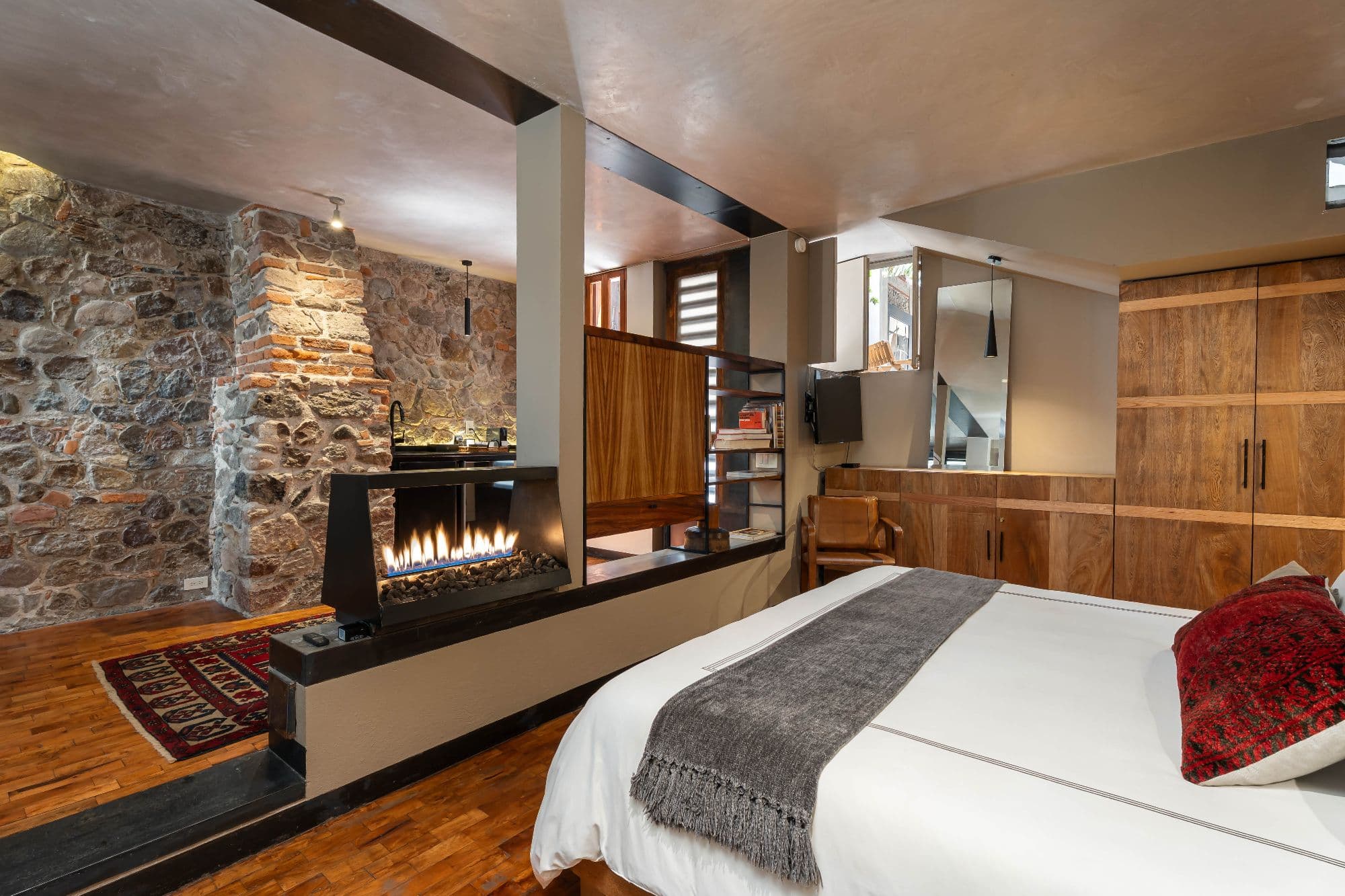 The Lofts — Centro, San Miguel de Allende — photo 10 — luxurious fireplace suite, rustic elegance