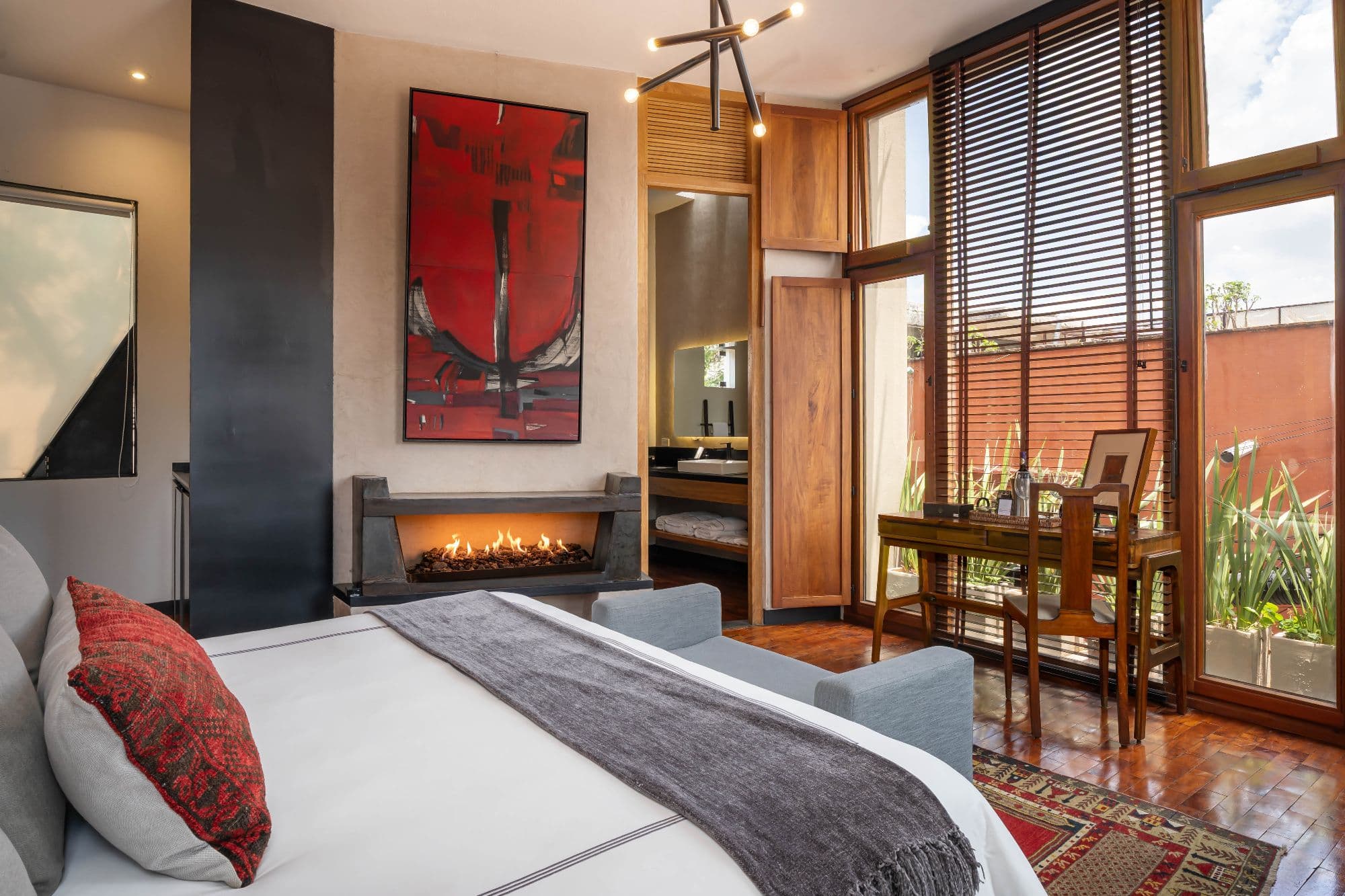 The Lofts — Centro, San Miguel de Allende — photo 23 — luxurious suite with fireplace and terrace