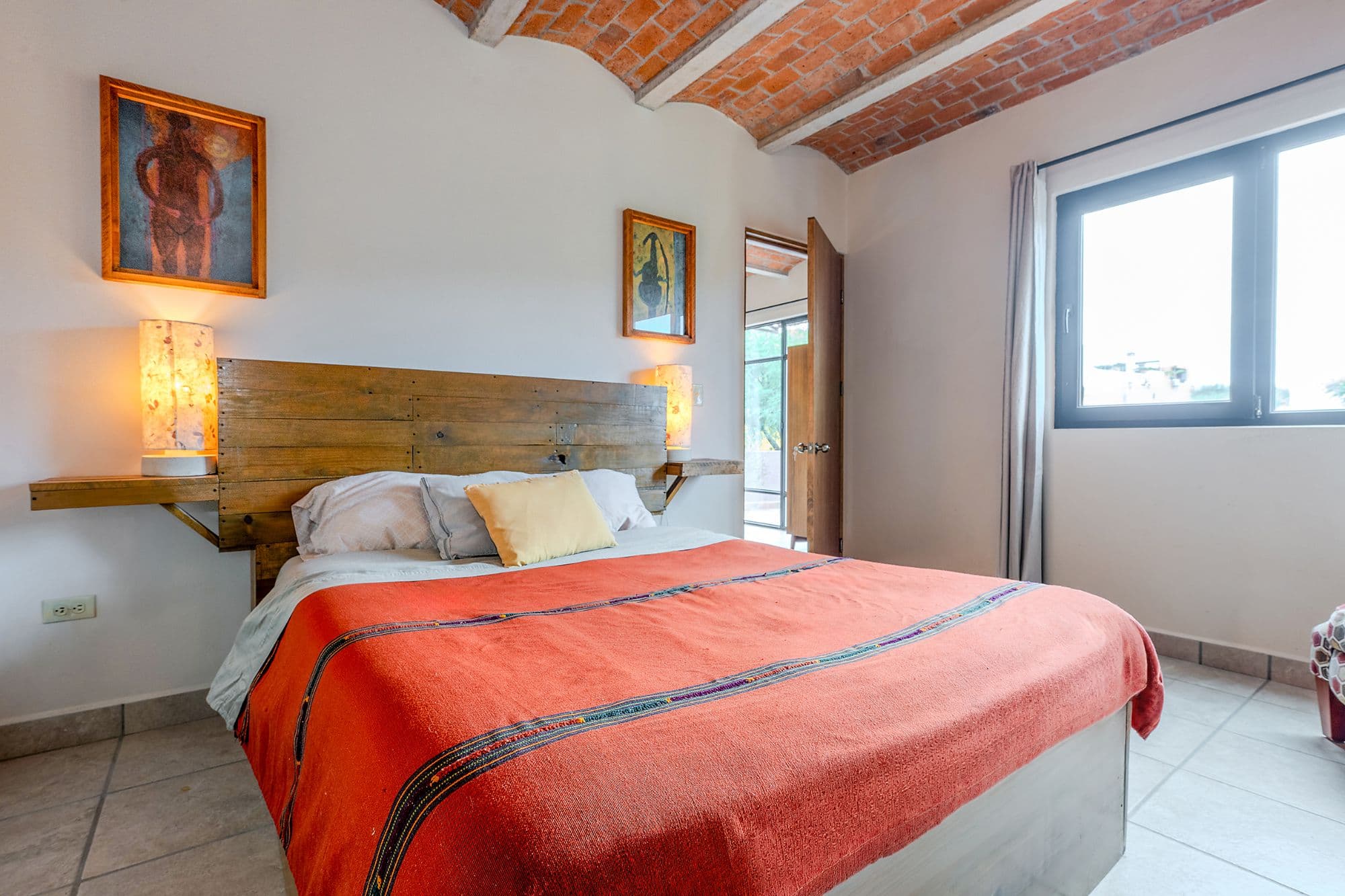 Casa Malva — Valle del Maíz, San Miguel de Allende — photo 23 — rustic-chic bedroom, exposed brick charm