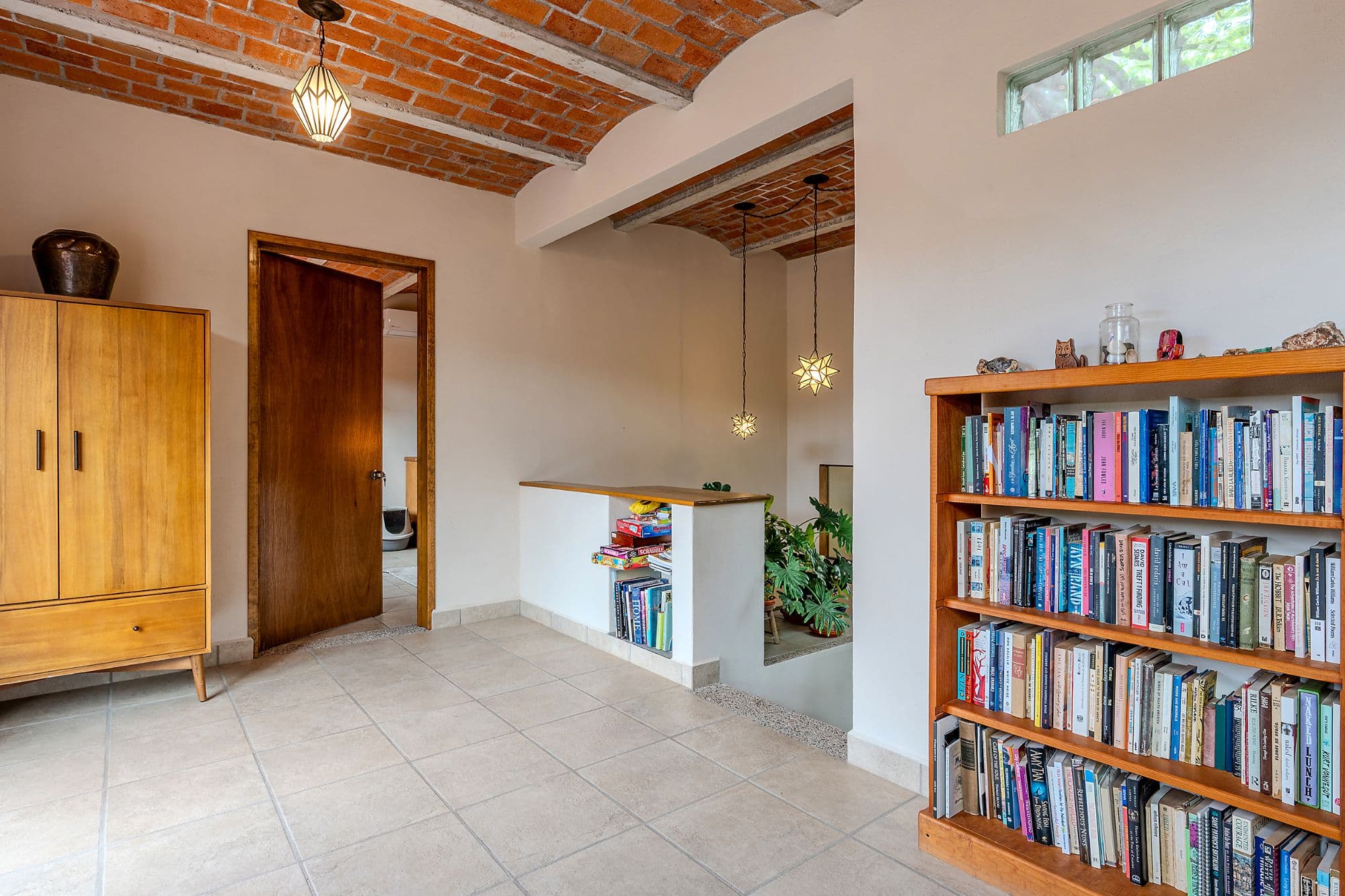 Casa Malva — Valle del Maíz, San Miguel de Allende — photo 15 — sunlit library with rustic charm
