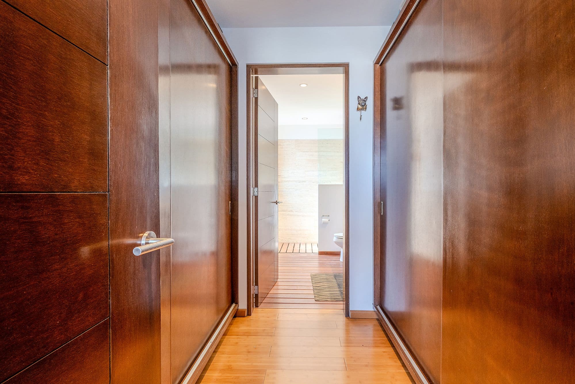 Casa Adrian — San Antonio, San Miguel de Allende — photo 16 — elegant hallway showcasing timeless wood craftsmanship
