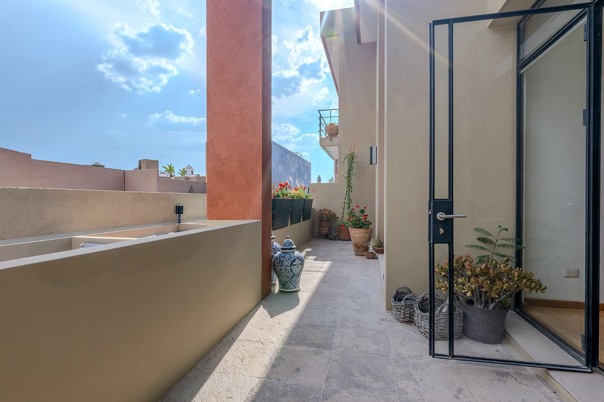 Casa Adrian — San Antonio, San Miguel de Allende — photo 14 — sunlit rooftop terrace with architectural charm