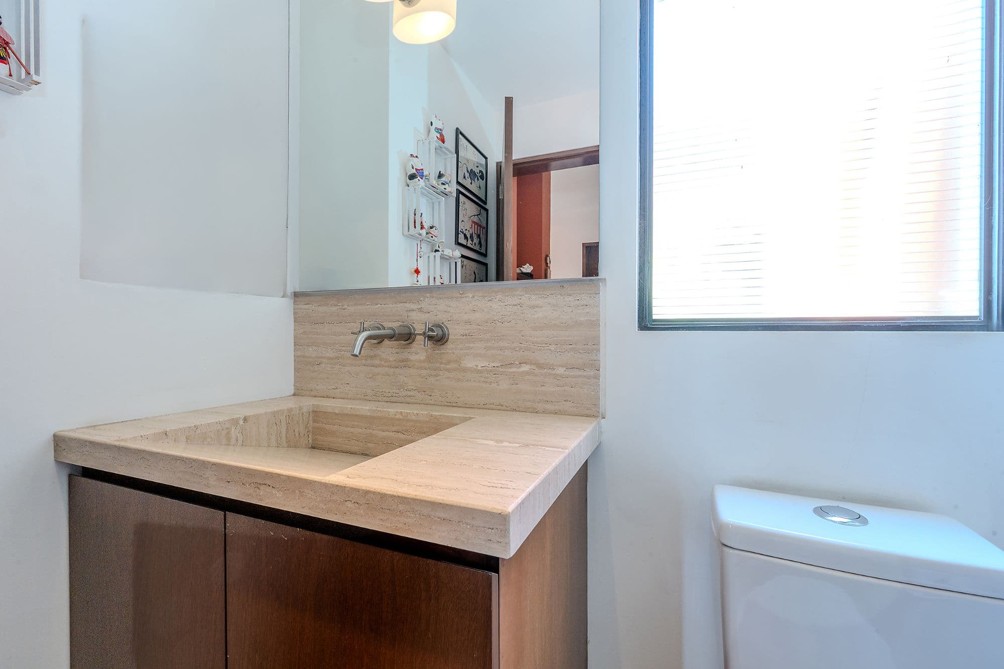 Casa Adrian — San Antonio, San Miguel de Allende — photo 10 — elegant travertine sink with refined minimalism