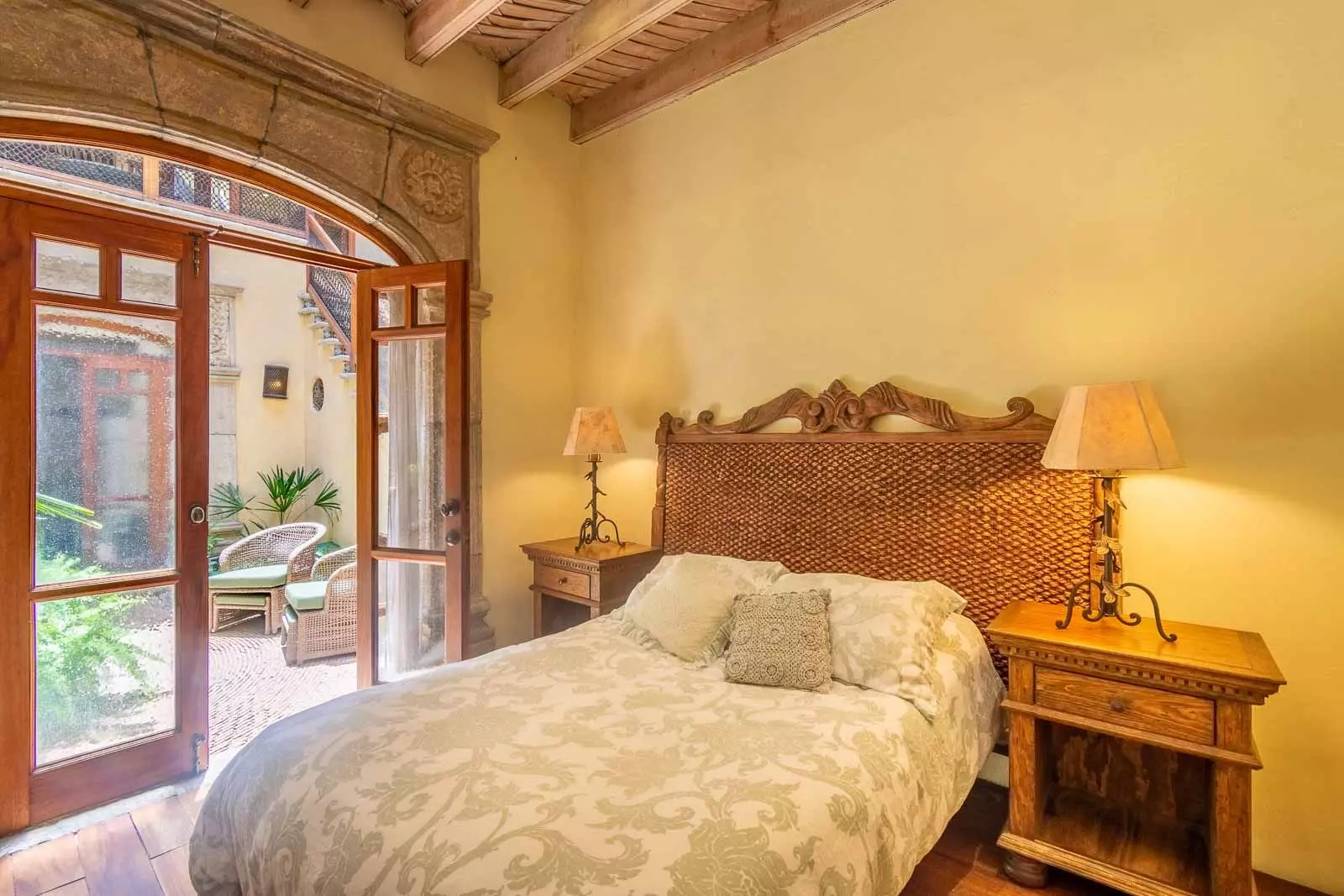 Casa la Perla — Ojo de Agua, San Miguel de Allende — photo 6 — sunlit colonial bedroom, rustic elegance
