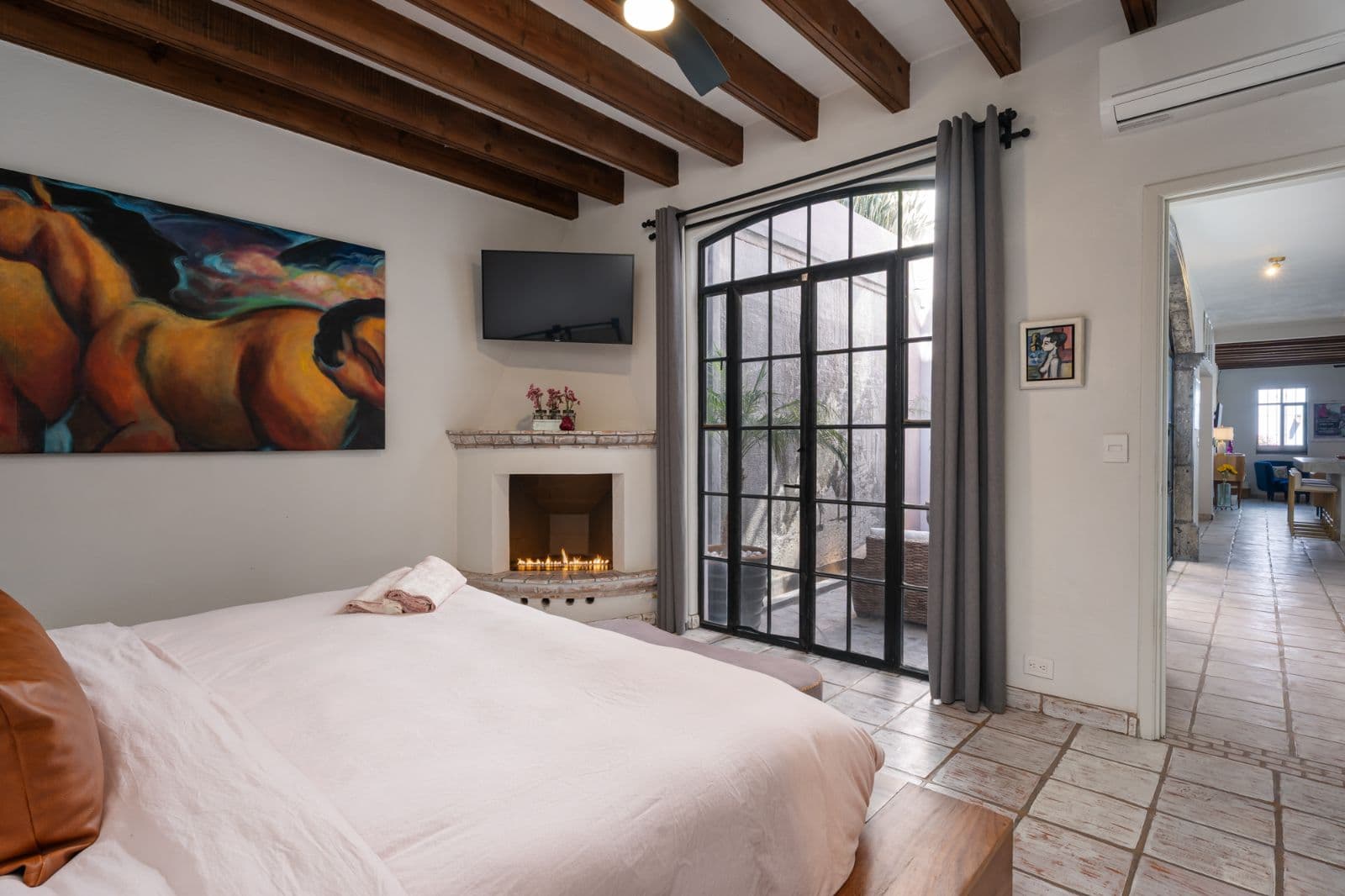 Casa Bruno — Guadalupe, San Miguel de Allende — photo 10 — elegant master suite, fireplace, terrace views
