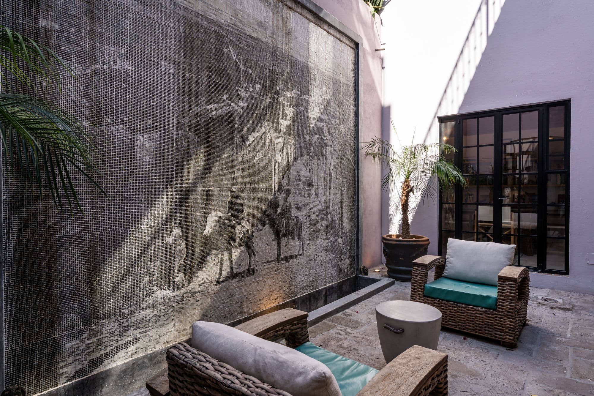 Casa Bruno — Guadalupe, San Miguel de Allende — photo 13 — serene courtyard with artistic mosaic walls