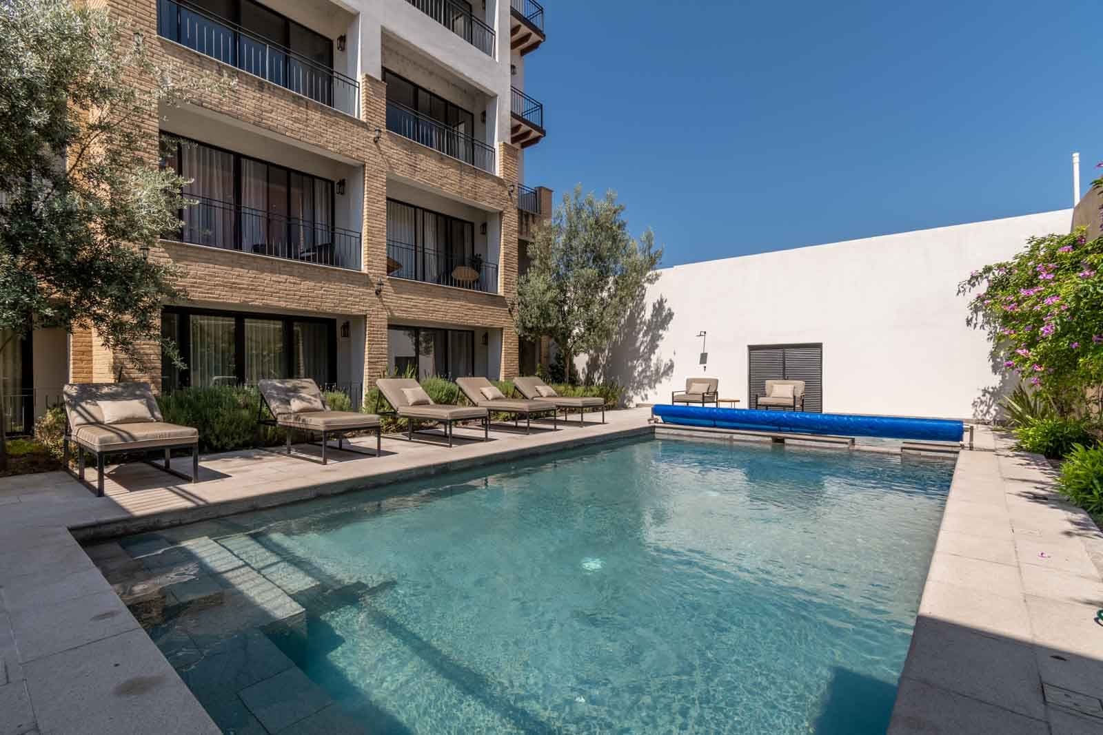 La Estación Studio — Centro, San Miguel de Allende — photo 13 — resort-style courtyard with sparkling pool oasis