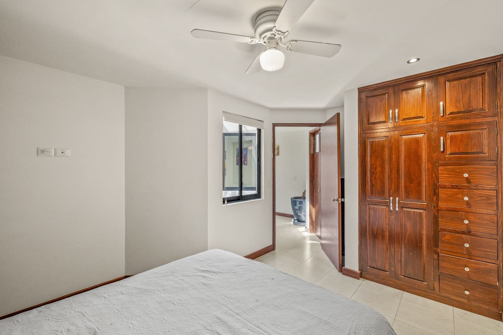Casa Gorrion — Las Brisas, San Miguel de Allende — photo 10 — spacious bedroom, rich wood cabinetry