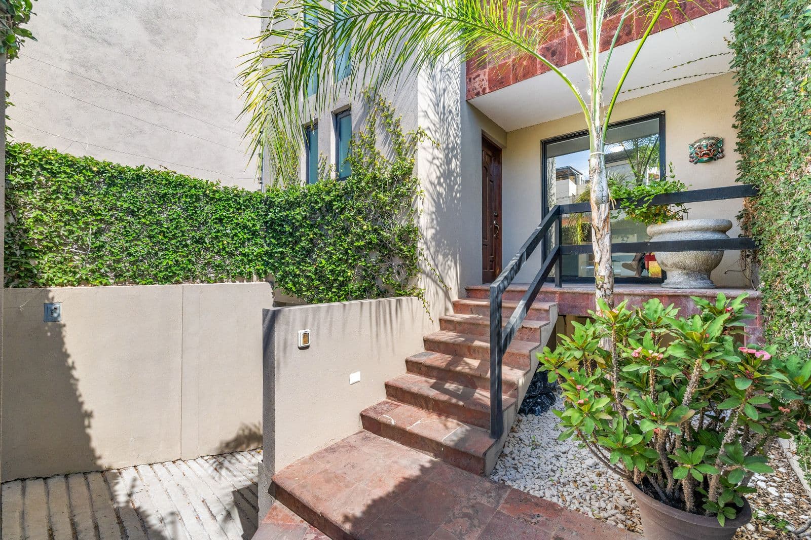 Casa Gorrion — Las Brisas, San Miguel de Allende — photo 22 — verdant courtyard entry, timeless charm