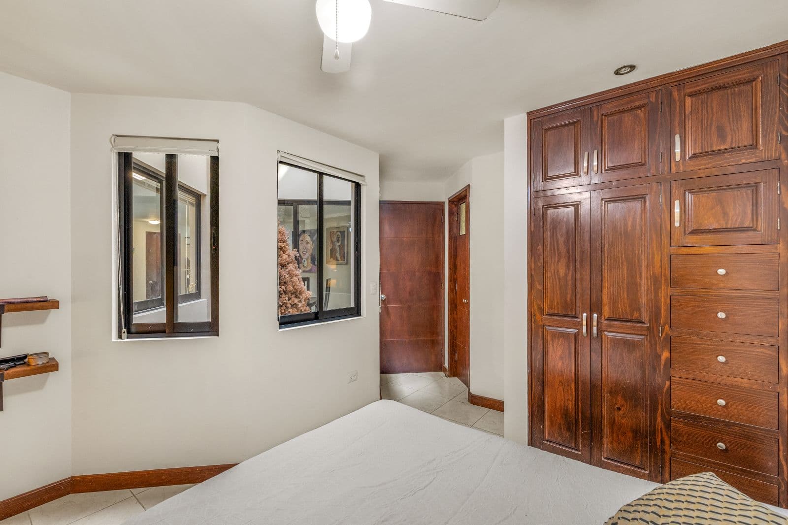 Casa Gorrion — Las Brisas, San Miguel de Allende — photo 5 — spacious bedroom, elegant wood cabinetry