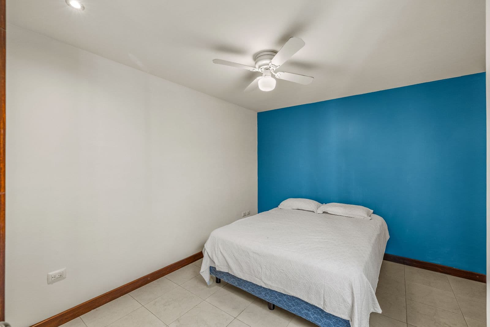 Casa Gorrion — Las Brisas, San Miguel de Allende — photo 8 — vibrant accent wall, serene bedroom retreat