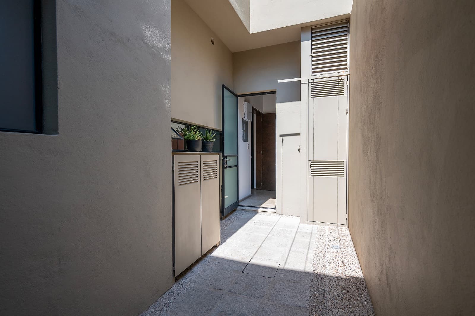 Modern Ground-Level Condo Near Centro — San Antonio, San Miguel de Allende — photo 22 — serene courtyard with architectural character