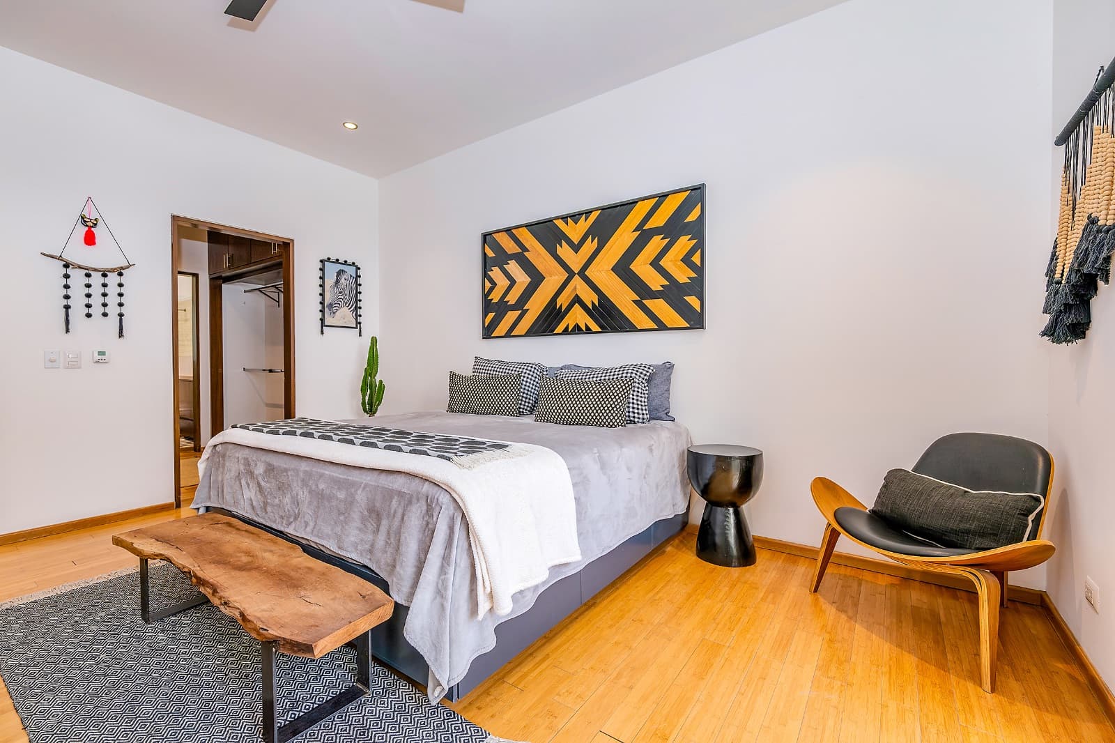 Modern Ground-Level Condo Near Centro — San Antonio, San Miguel de Allende — photo 9 — contemporary bedroom with artistic accents