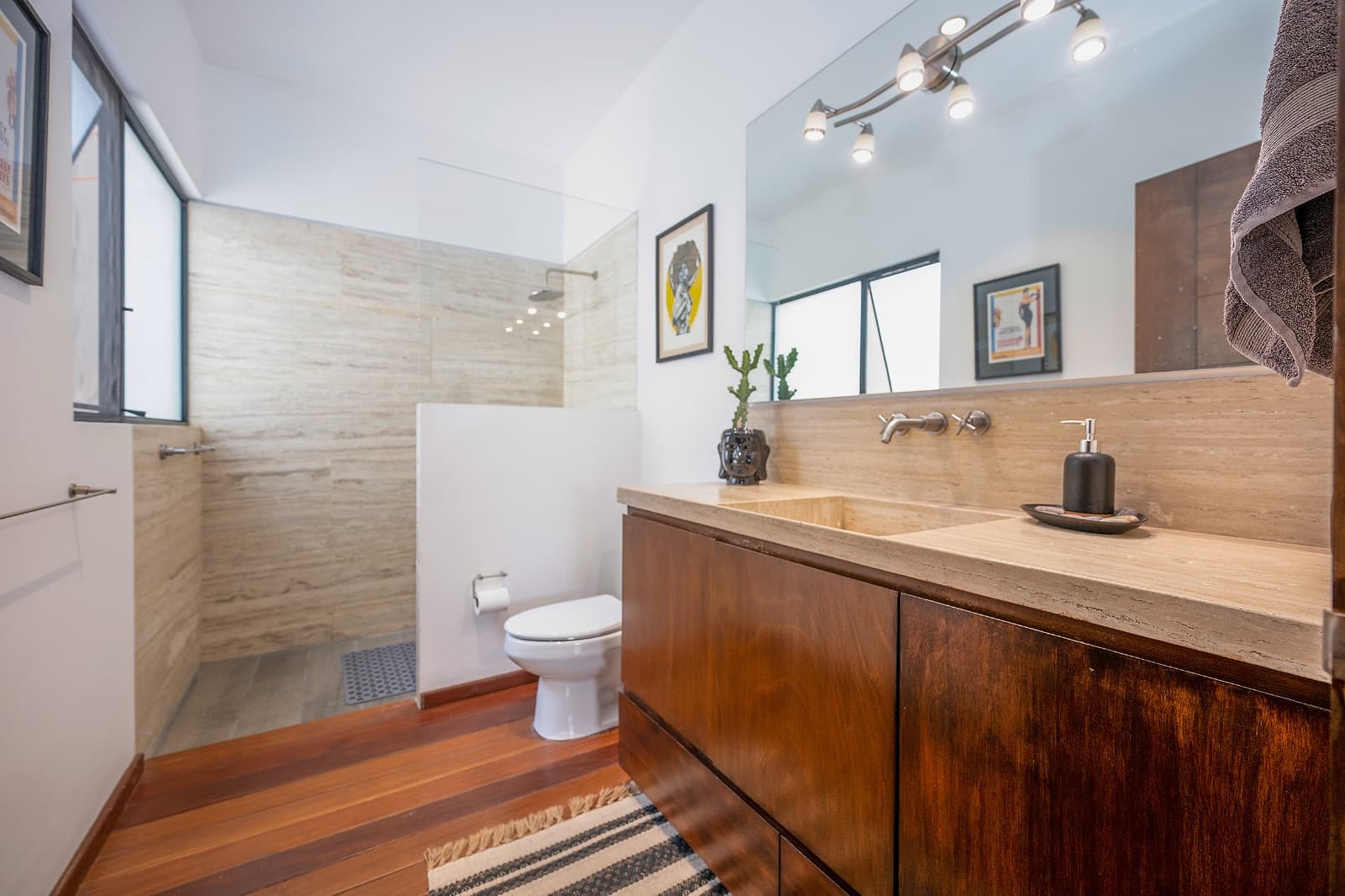 Modern Ground-Level Condo Near Centro — San Antonio, San Miguel de Allende — photo 8 — spa-inspired master bath with warmth