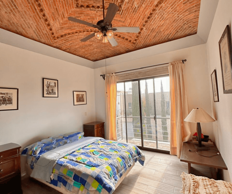 Villa San Gamaliel — El Paraiso, San Miguel de Allende — photo 13 — serene bedroom with soaring wooden ceilings