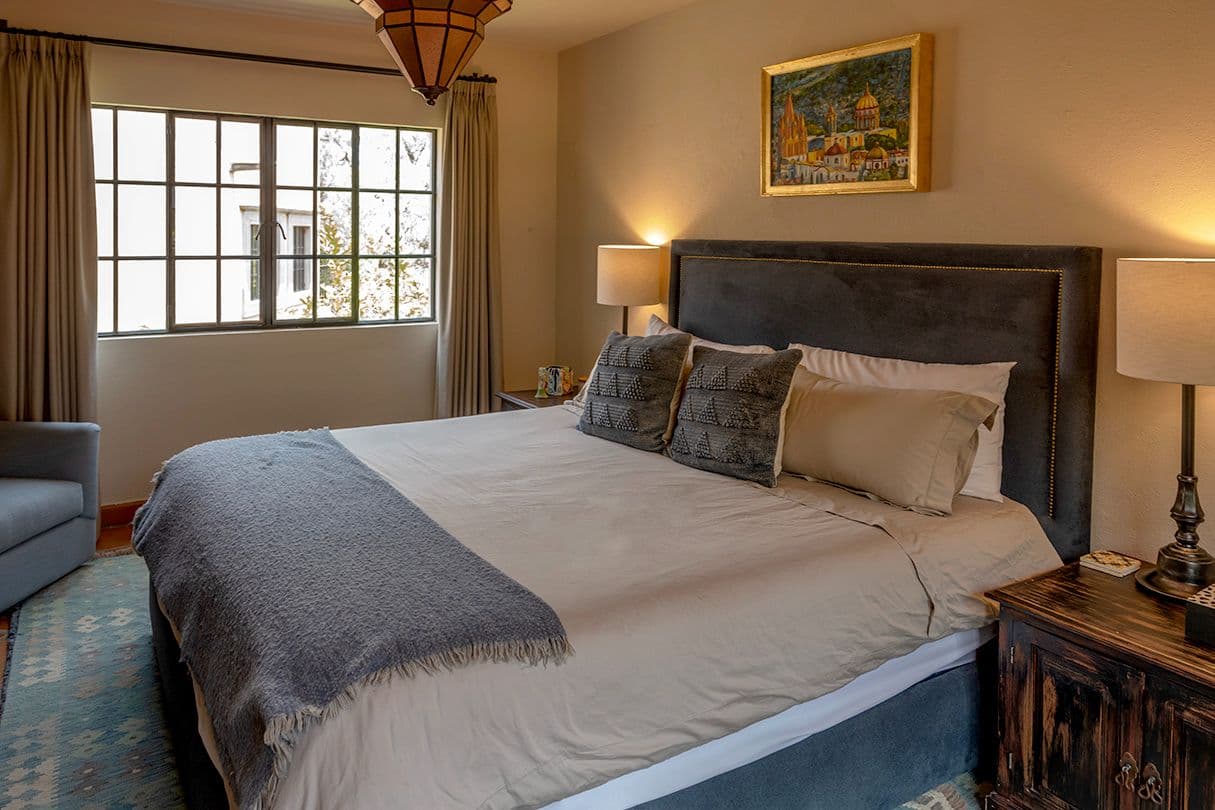 Casa Sol y Luna — Centro, San Miguel de Allende — photo 17 — serene master suite, golden light embraced